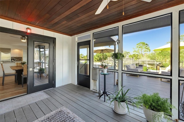 wooden deck with ceiling fan