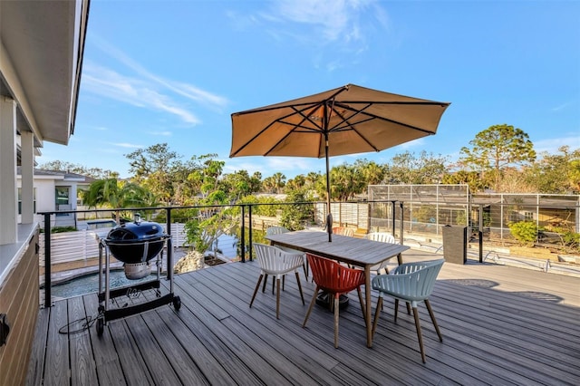 wooden deck with a grill