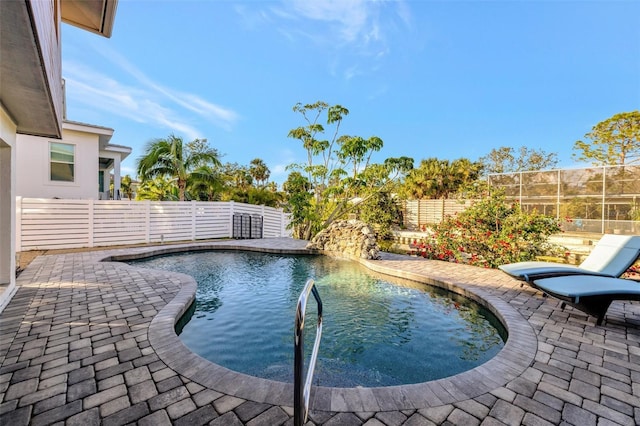 view of pool featuring a patio area