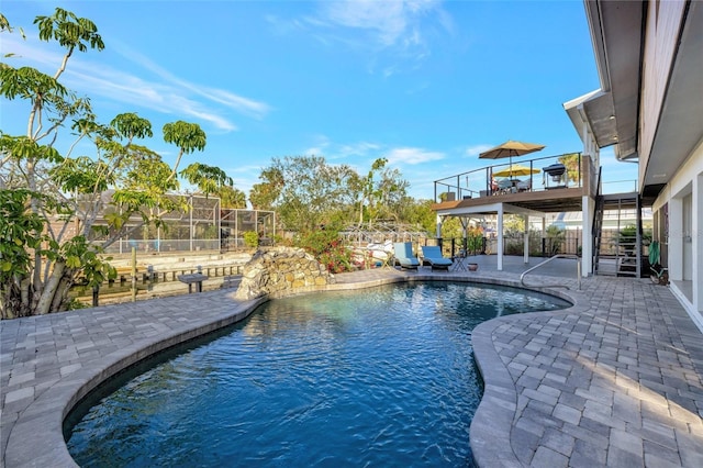 view of swimming pool with a patio