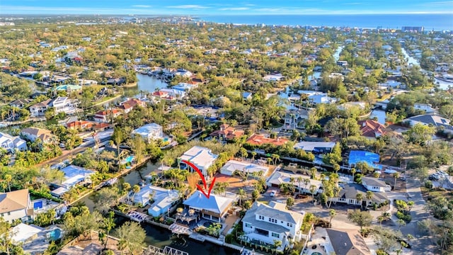 birds eye view of property featuring a water view