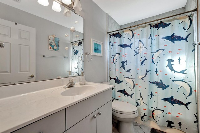 521 Cummings St, Sarasota, FL 34242 - full bath featuring vanity, tile patterned flooring, and a shower with shower curtain
