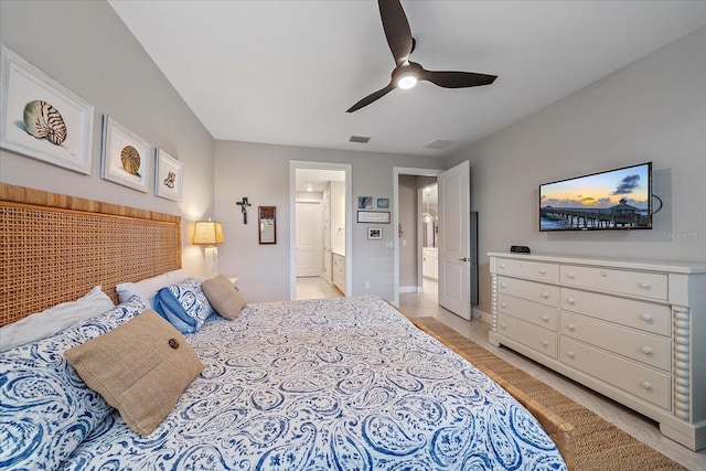 bedroom with ceiling fan and ensuite bath