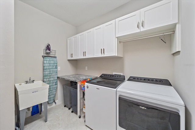 laundry room with cabinets and independent washer and dryer