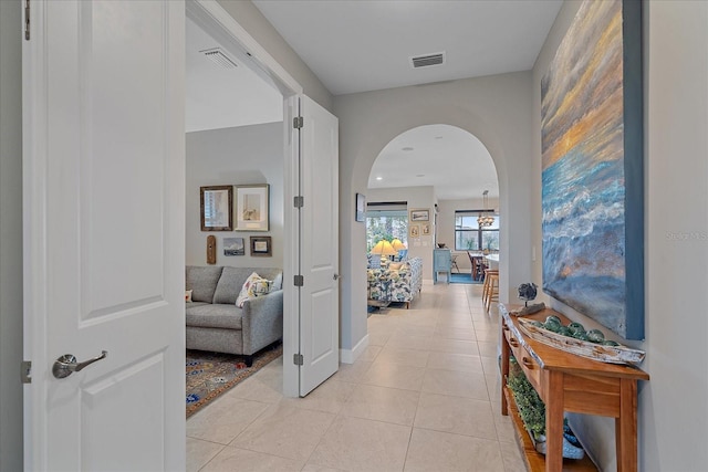 hallway featuring light tile patterned floors