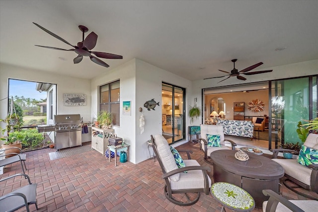 view of patio / terrace featuring ceiling fan and a grill