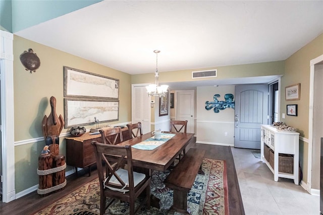 dining space featuring an inviting chandelier