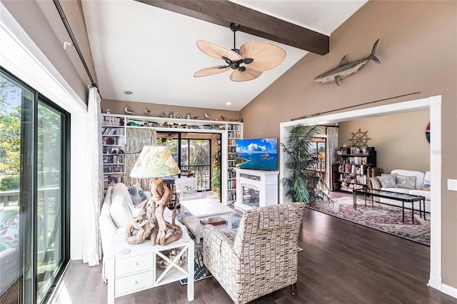 interior space with ceiling fan, a healthy amount of sunlight, dark hardwood / wood-style floors, and vaulted ceiling with beams