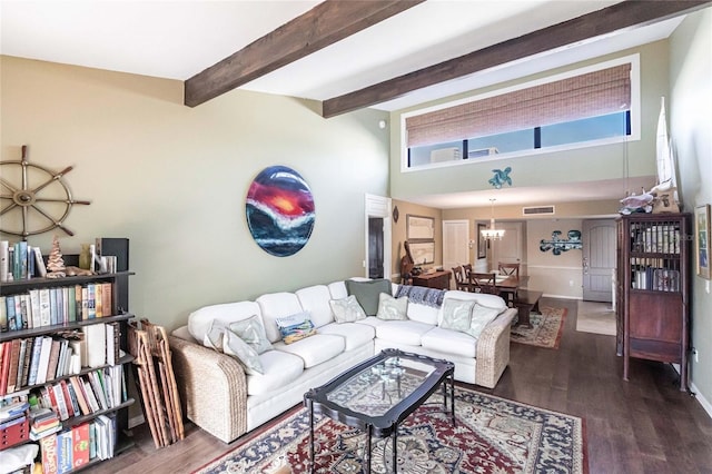 living room with beam ceiling, dark hardwood / wood-style flooring, and an inviting chandelier