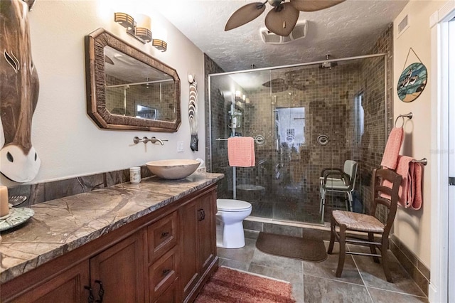 bathroom featuring walk in shower, vanity, and toilet