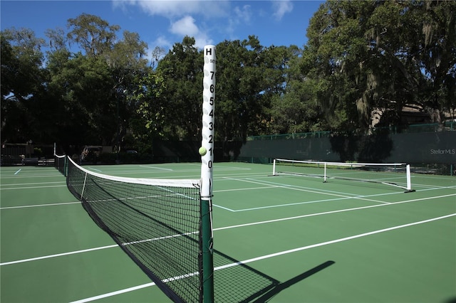 view of sport court with community basketball court and fence