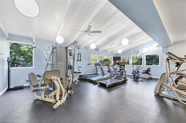 gym featuring baseboards, vaulted ceiling, a ceiling fan, and a healthy amount of sunlight