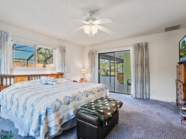 bedroom with ceiling fan, dark carpet, a textured ceiling, and access to outside