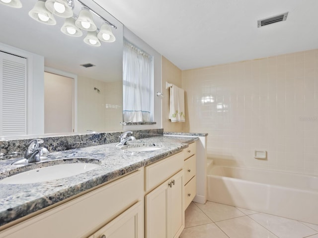 bathroom with tile patterned floors and vanity