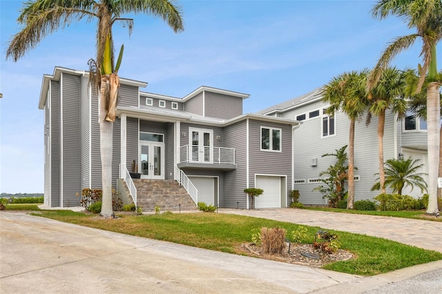 view of front of house featuring a garage and french doors