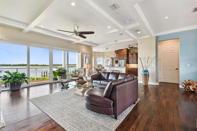 living room with beam ceiling, ceiling fan, and dark wood-type flooring