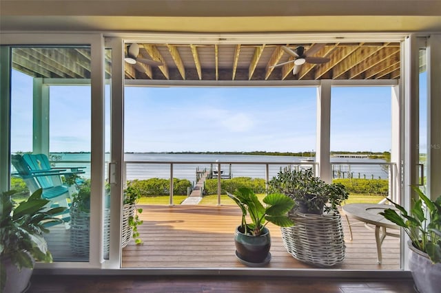 interior space featuring ceiling fan and a water view