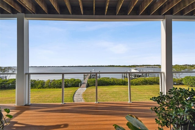 deck featuring a yard and a water view