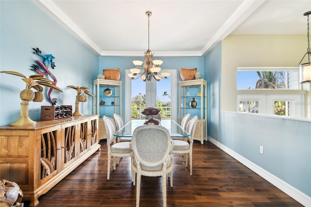 dining space with a chandelier, french doors, dark hardwood / wood-style floors, and ornamental molding