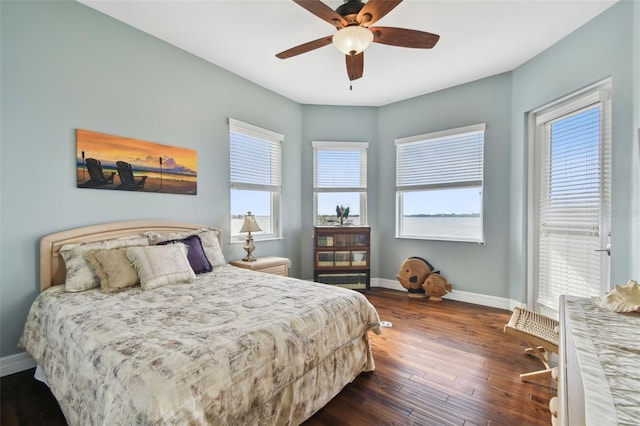 bedroom featuring dark hardwood / wood-style flooring and ceiling fan