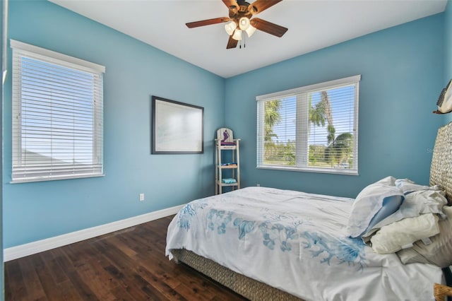 bedroom featuring ceiling fan and dark hardwood / wood-style flooring