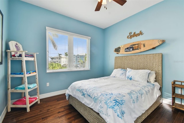 bedroom featuring ceiling fan and dark hardwood / wood-style floors