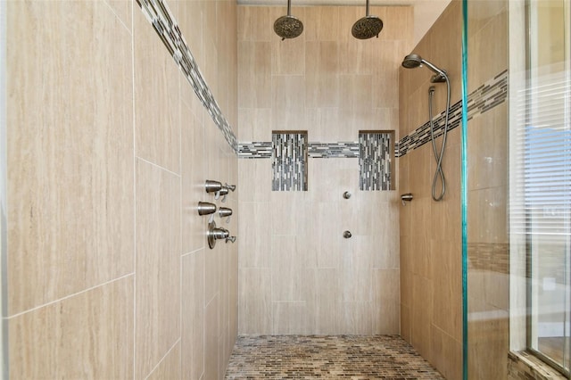 bathroom with a tile shower