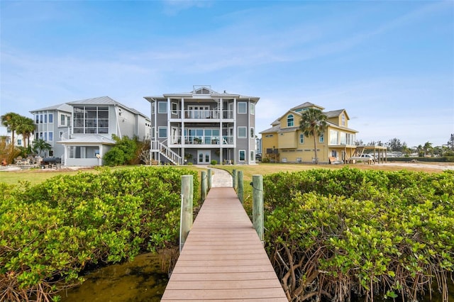 rear view of house featuring a water view