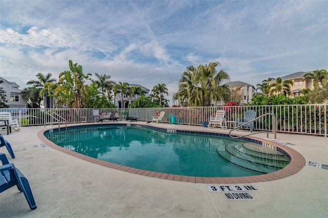 view of swimming pool with a patio area