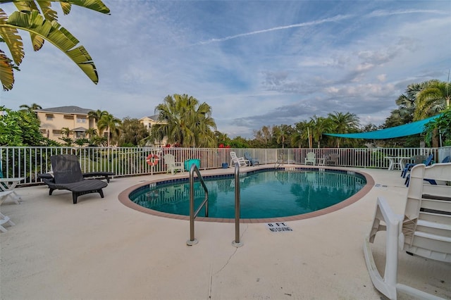 view of swimming pool featuring a patio