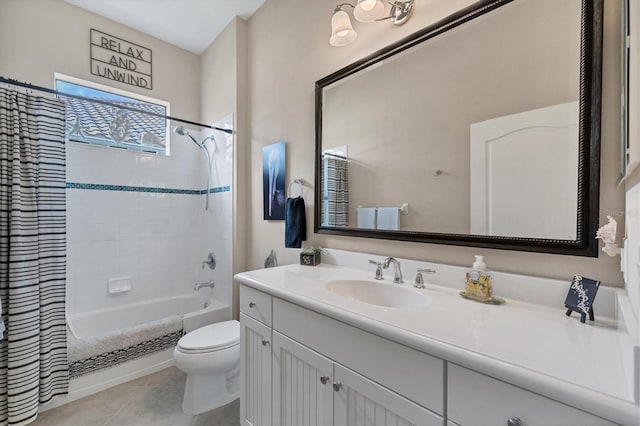 full bathroom with tile patterned floors, vanity, shower / tub combo, and toilet