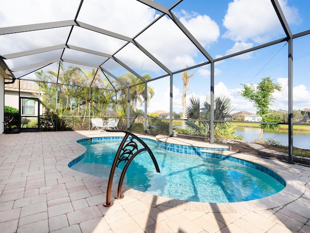 view of swimming pool featuring a patio, a water view, and a lanai