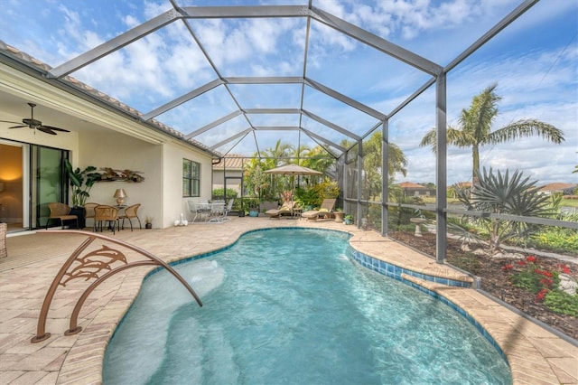 view of pool featuring a lanai, a patio area, and ceiling fan