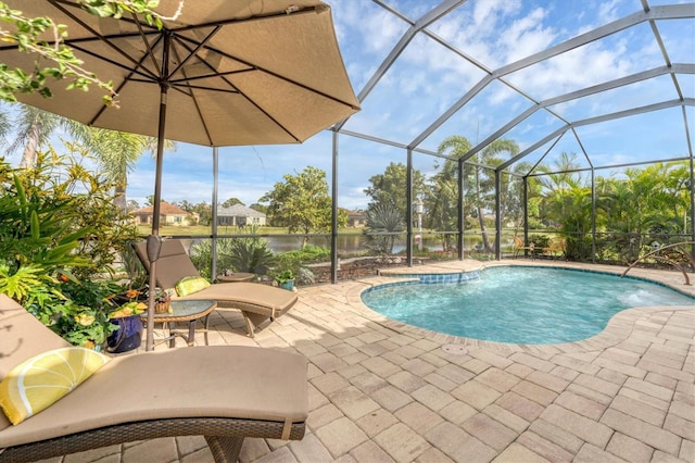 view of pool featuring pool water feature, glass enclosure, and a patio