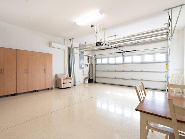 garage featuring a garage door opener and an AC wall unit