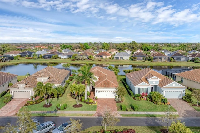 birds eye view of property featuring a water view