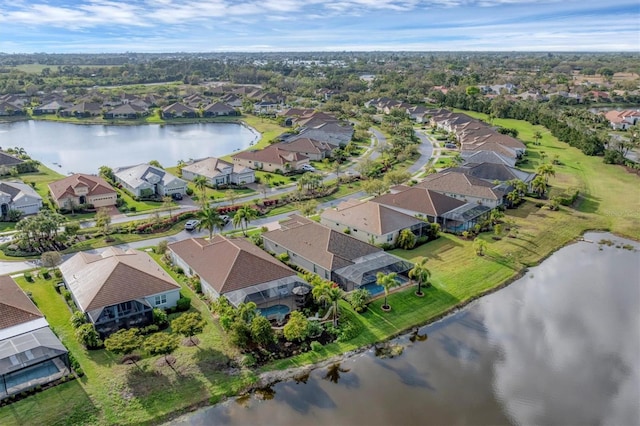 drone / aerial view with a water view