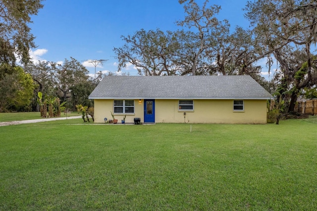 ranch-style house with a front yard