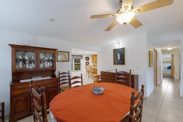 dining room featuring ceiling fan and light tile patterned floors