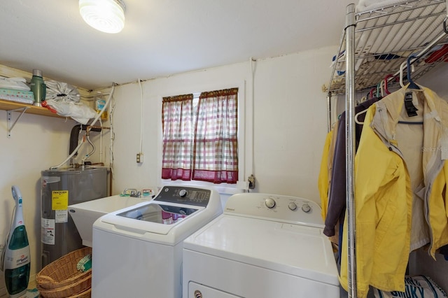 laundry room featuring separate washer and dryer and electric water heater