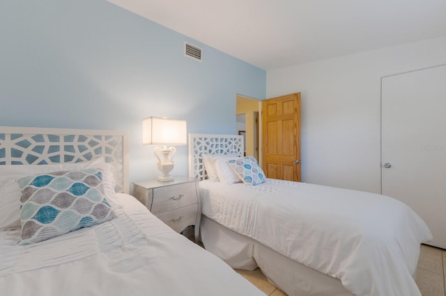 bedroom featuring light tile patterned floors