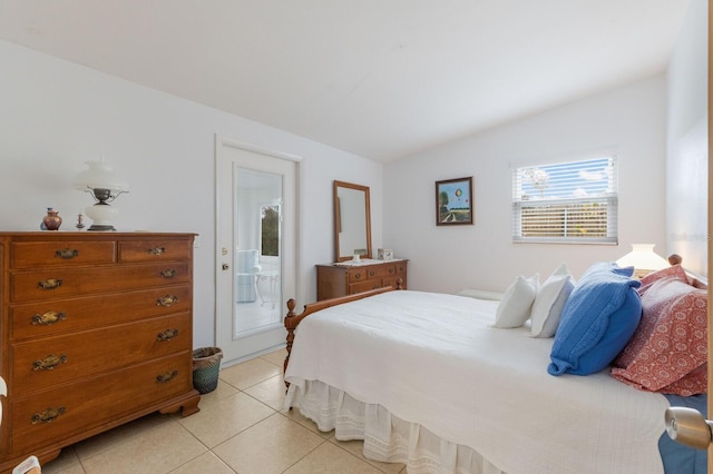 bedroom featuring light tile patterned flooring and access to exterior