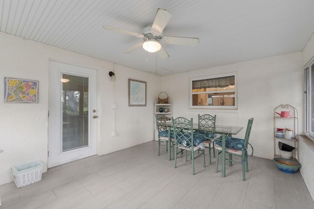 dining area featuring ceiling fan and a healthy amount of sunlight