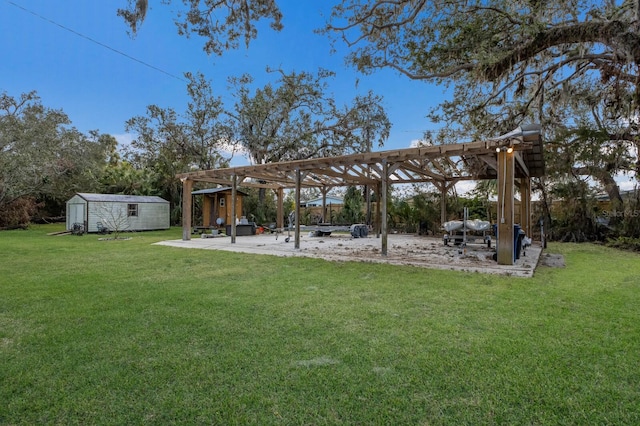 view of yard with a pergola and a storage shed