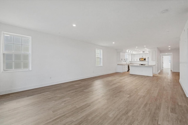 unfurnished living room featuring light hardwood / wood-style flooring