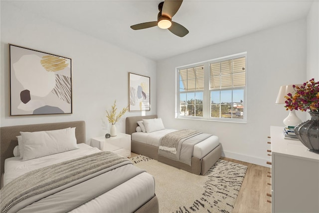 bedroom featuring light hardwood / wood-style flooring and ceiling fan