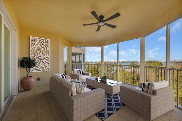 sunroom featuring ceiling fan and a healthy amount of sunlight