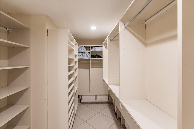 walk in closet featuring light tile patterned floors