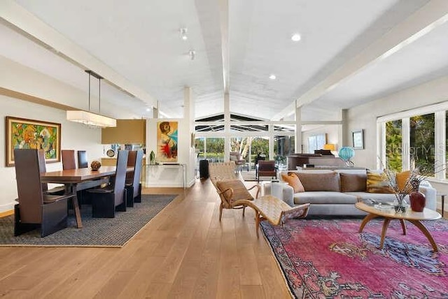 living room featuring beam ceiling and wood-type flooring