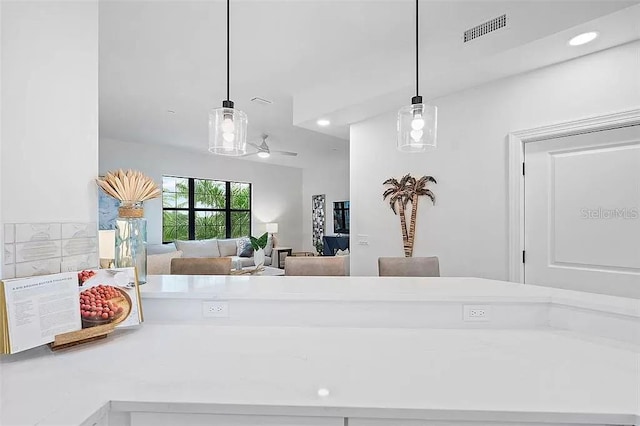 interior space featuring pendant lighting and ceiling fan